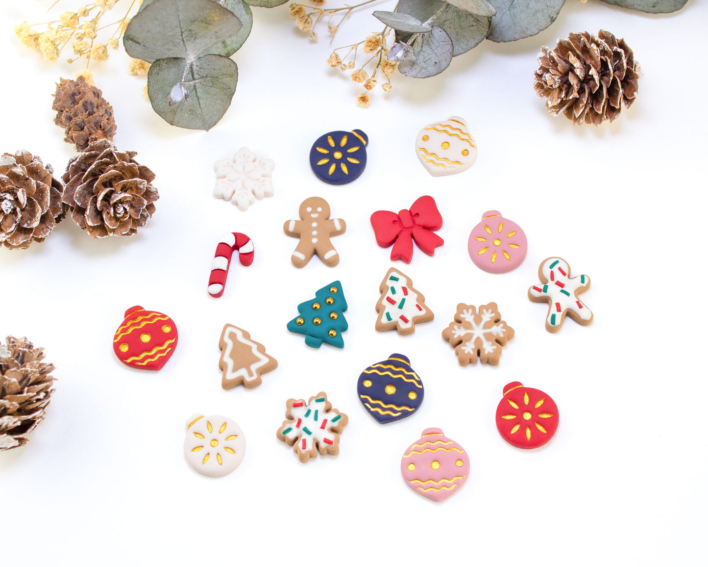 Collection of handmade Christmas stud earrings in festive designs, including gingerbread men, snowflakes, Christmas trees, candy canes, and baubles. Perfect holiday gift for her.