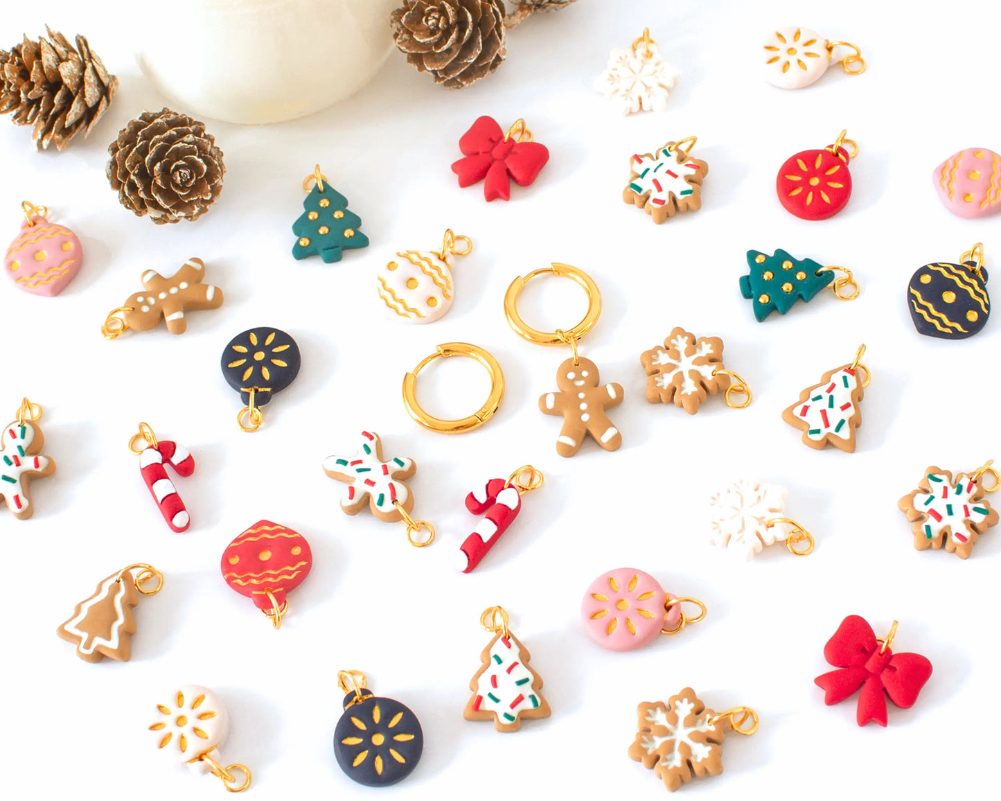 Handmade Christmas charm hoop earrings with festive polymer clay charms, Featuring gingerbread, snowflake, candy cane, Christmas tree, and holiday ornament designs.