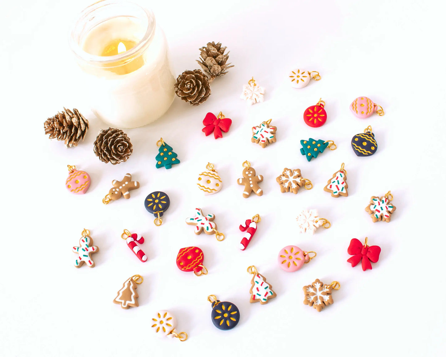 Full set of Christmas-themed handmade polymer clay charms, Gingerbread men, snowflakes, Christmas trees, and candy canes for festive hoop earrings.