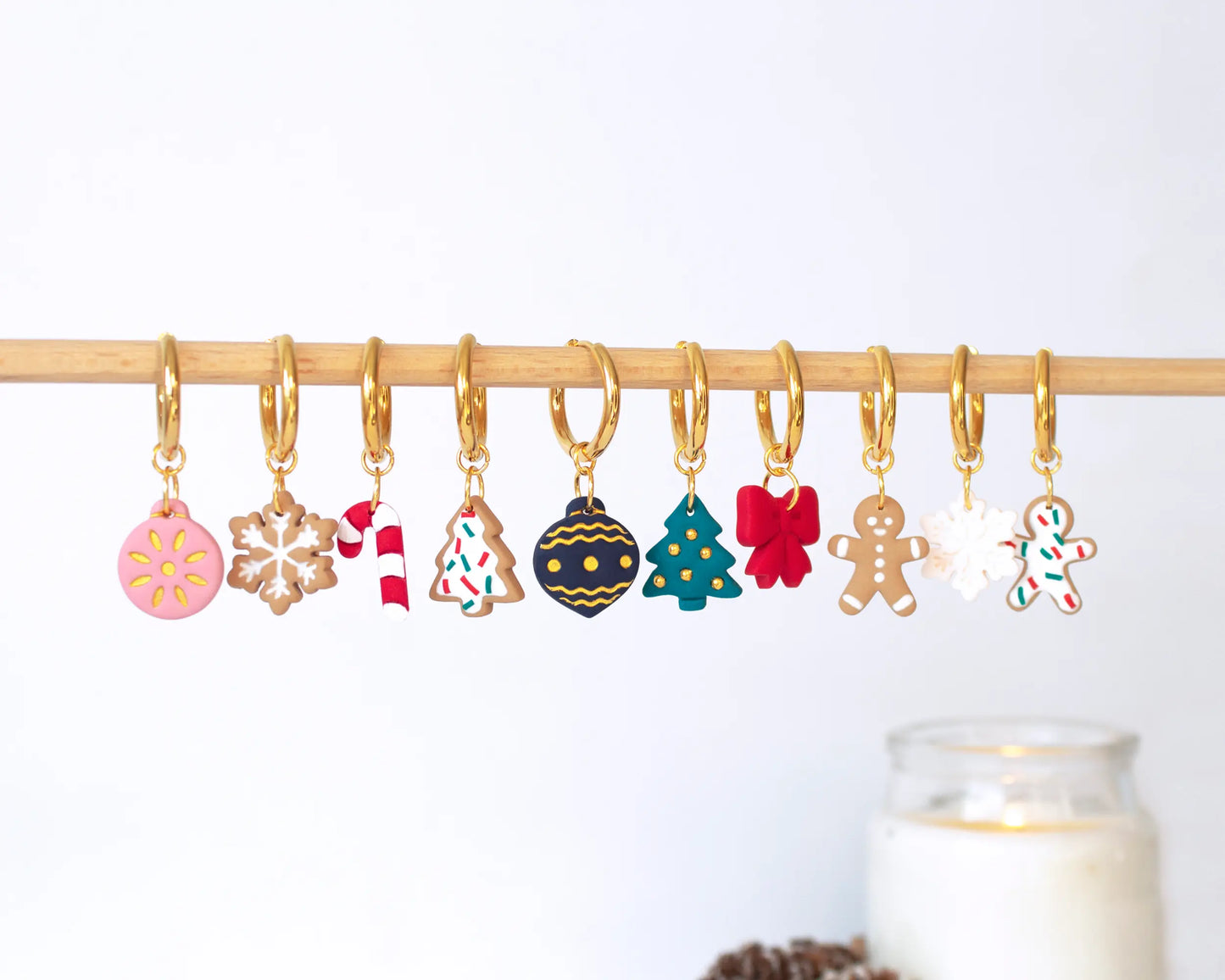 Full set of Christmas-themed handmade polymer clay charms, Gingerbread men, snowflakes, Christmas trees, and candy canes for festive hoop earrings.