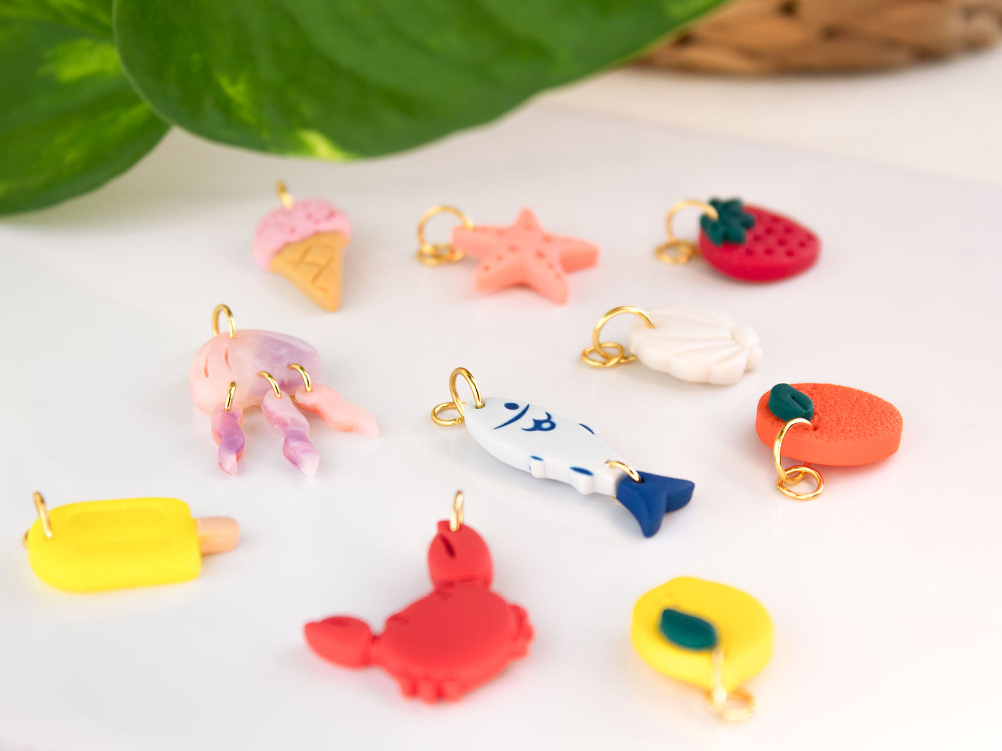 handmade clay charms for hoop earrings jellyfish starfish shell lemon orange crab popsicle on white