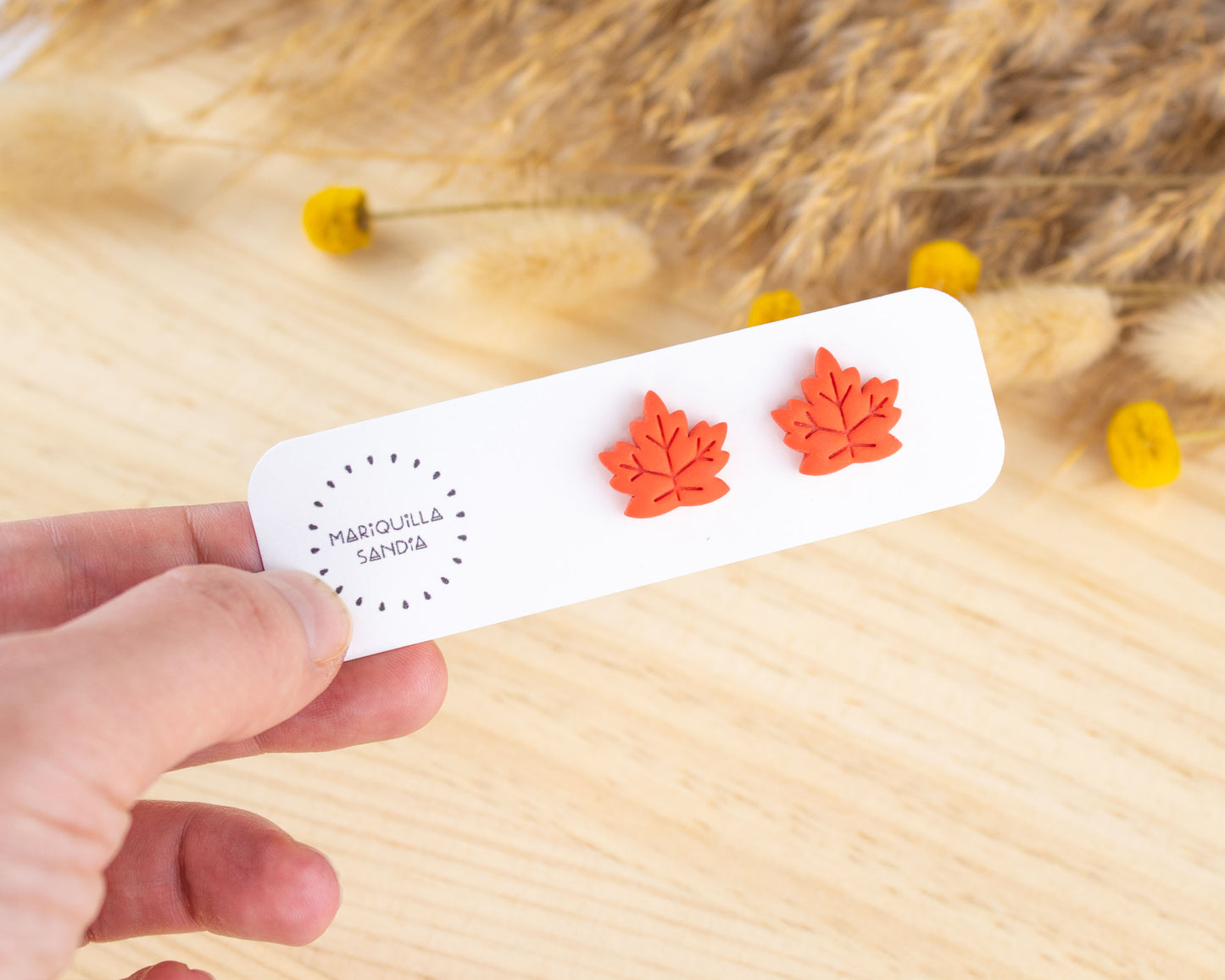 Handmade coral-colored leaf earrings, lightweight polymer clay studs for a unique fall look.