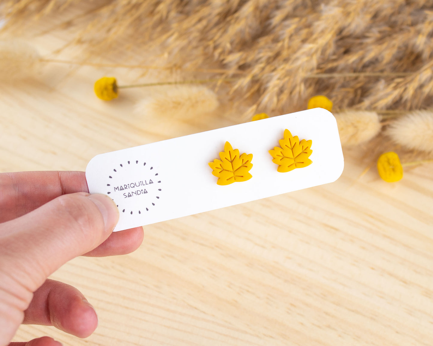 Handmademustard-colored leaf earrings, lightweight polymer clay studs for a unique fall look.