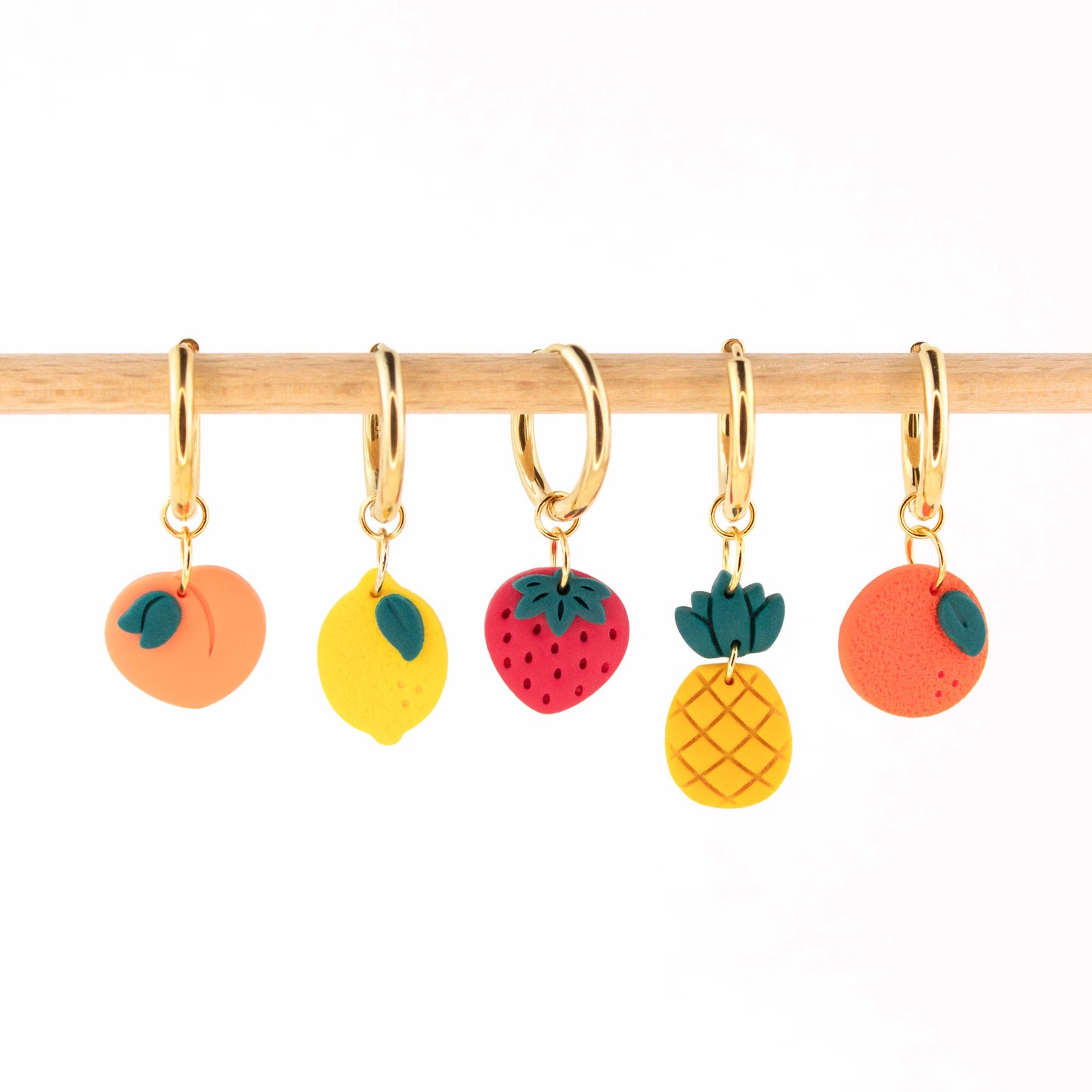 gold charm hoop earrings with fruit charms peach lemon strawberry pineapple orange