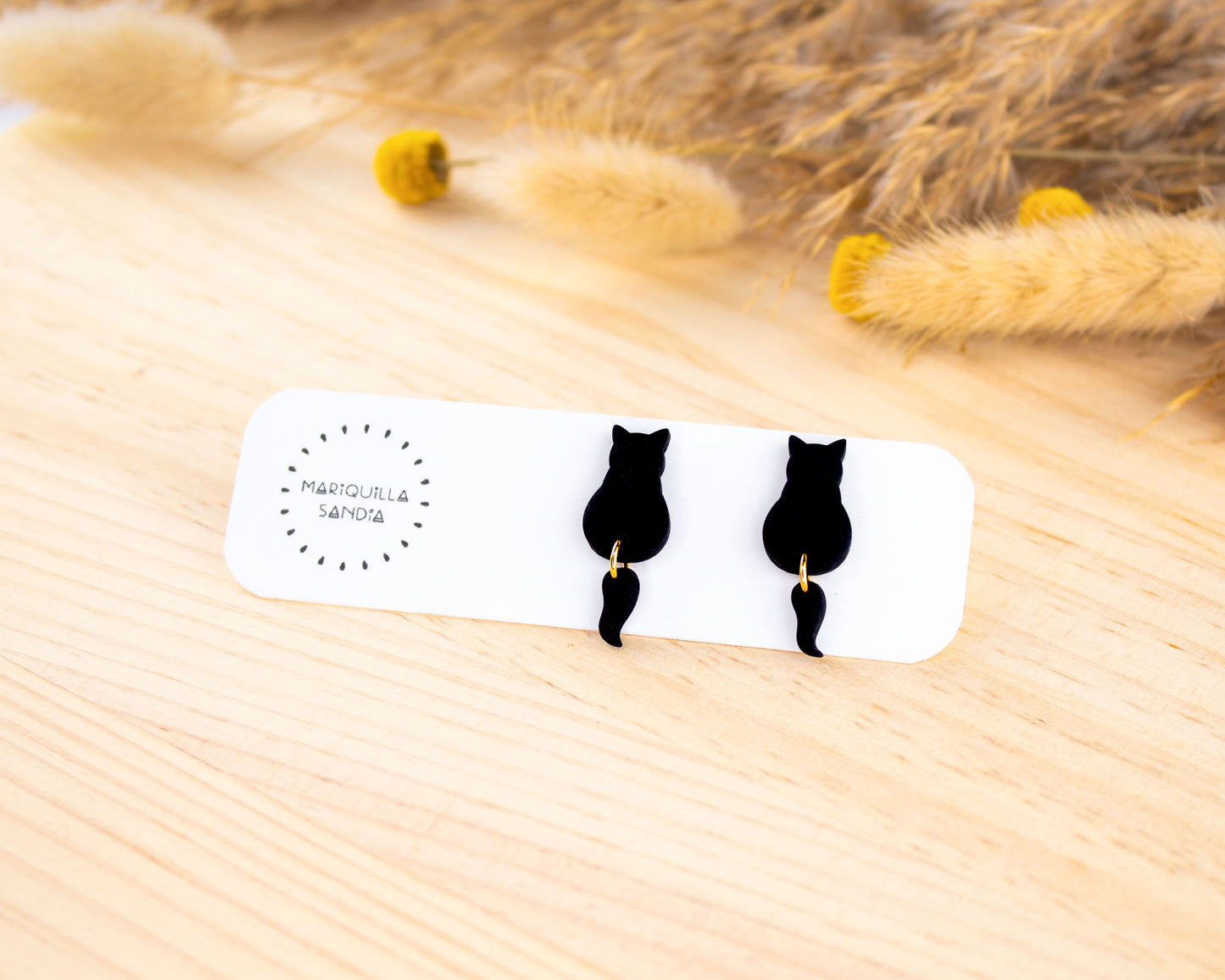 Handmade black cat earrings, hypoallergenic dangle studs for a unique fall style.