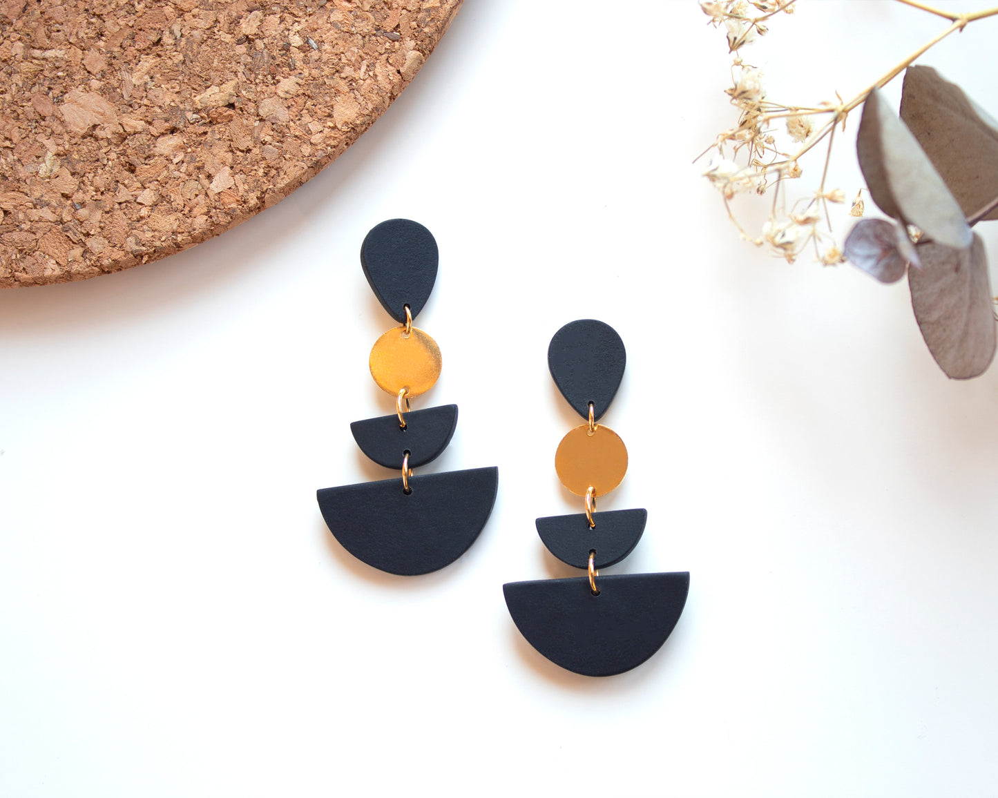Black geometric earrings with gold accents, handmade with polymer clay and 925 sterling silver posts