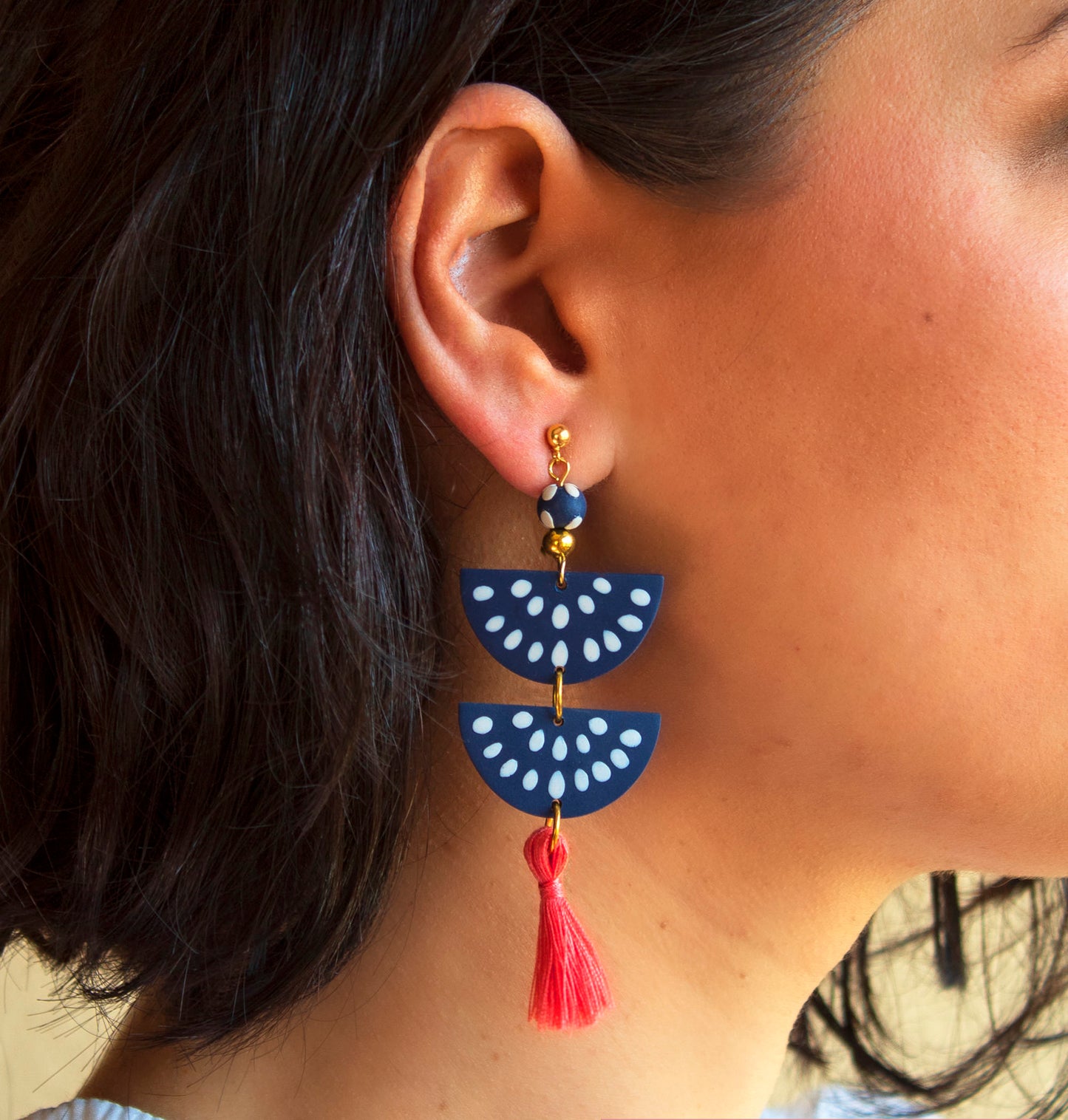 Handmade clay earrings in navy blue with customizable tassel options
