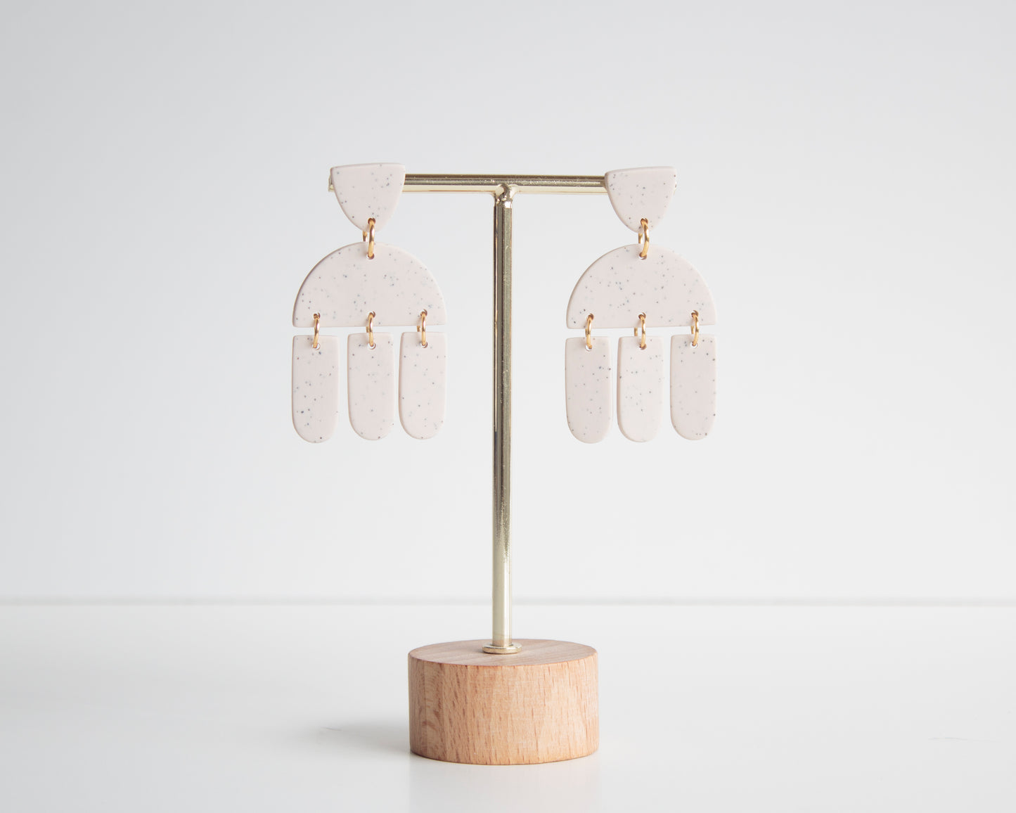 White geometric earrings made from polymer clay, hypoallergenic and lightweight, ideal for boho fashion lovers