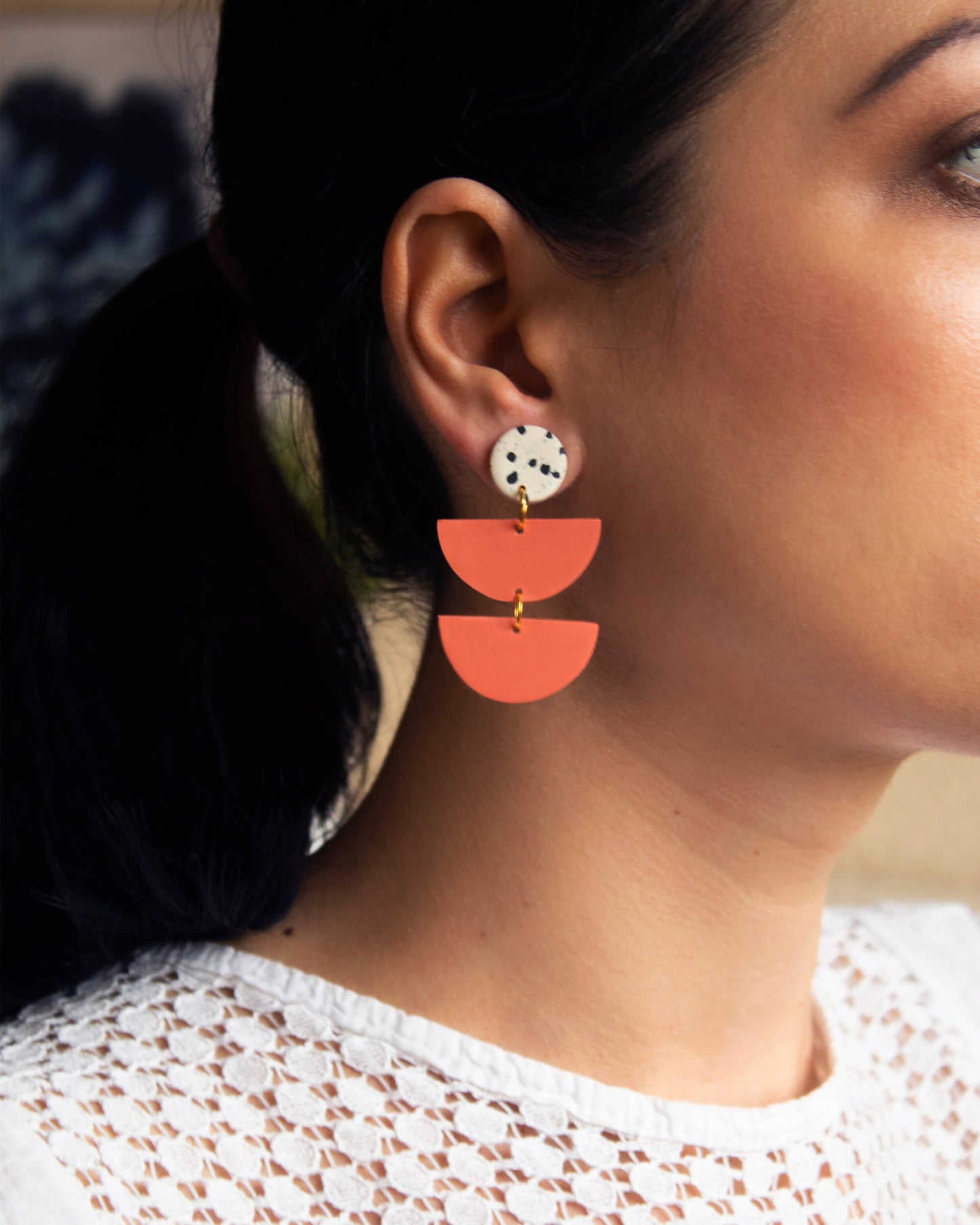 Coral color dangle earrings with boho style, handmade with hypoallergenic materials.