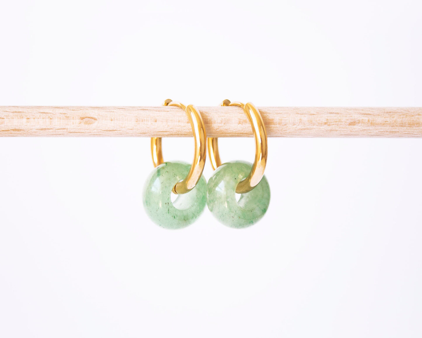 Minimalist gold hoop earrings with green Aventurine donut gemstone charms.