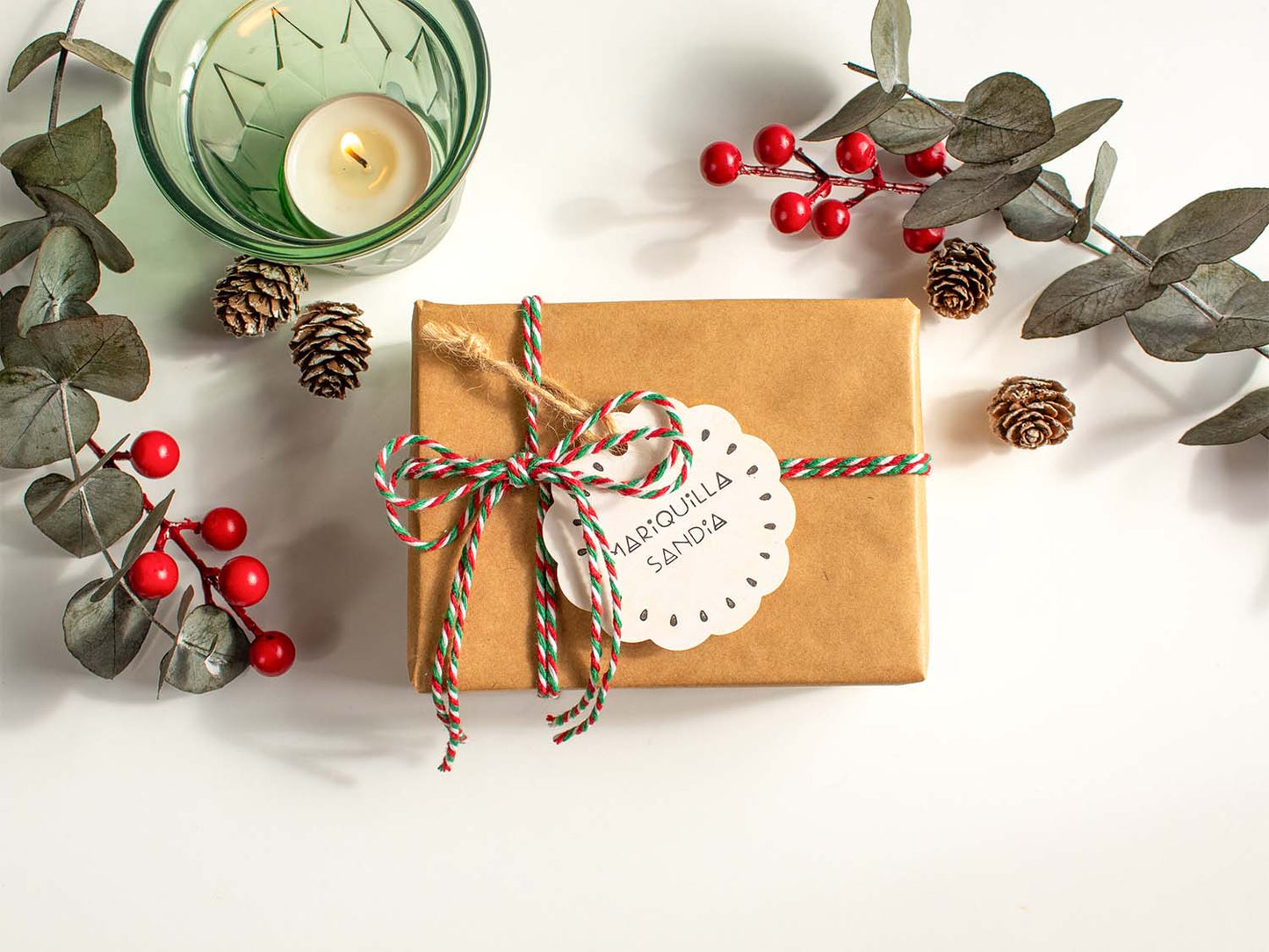 Gift wrapping option with kraft paper box red and green twine branded tag and message card