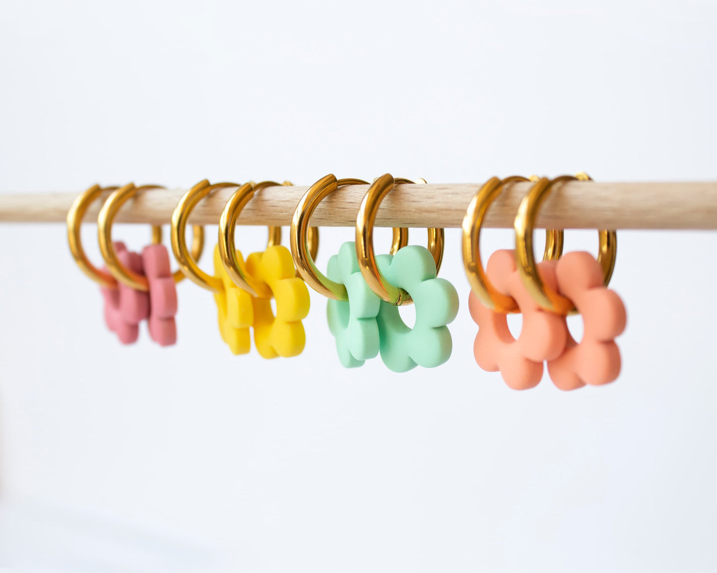 Customizable hoop earrings with interchangeable floral charm