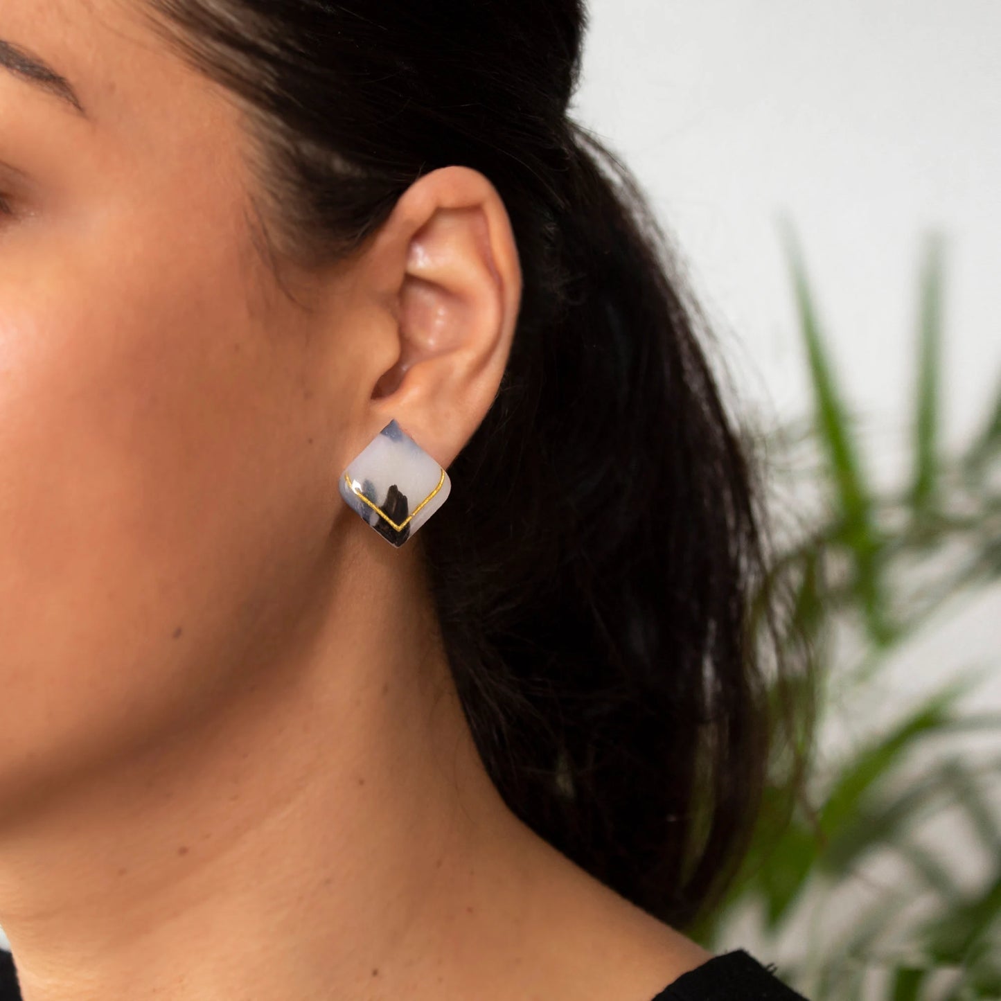 Large white clay stud earrings with golden detail handmade Art Deco design
