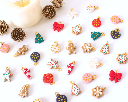 Full set of Christmas-themed handmade polymer clay charms, Gingerbread men, snowflakes, Christmas trees, and candy canes for festive hoop earrings.