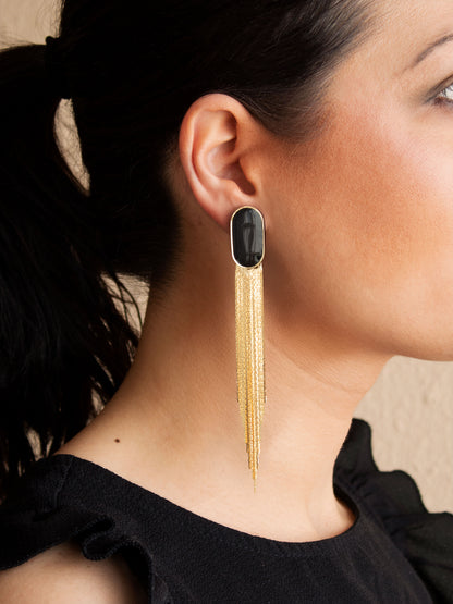 Black and gold extra long earrings with detachable chain fringe worn on ear