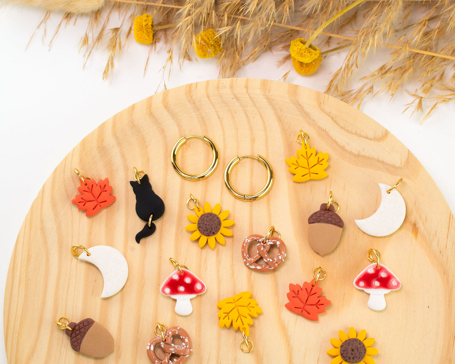 Interchangeable fall charm hoop earrings with hypoallergenic gold-plated hoops and autumn charms.