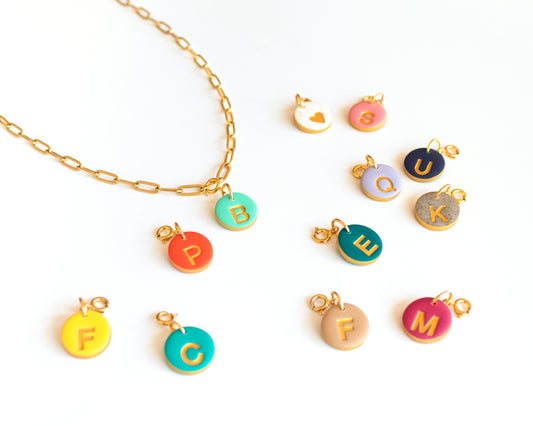 Personalized necklace with gold chain and colorful initial charms