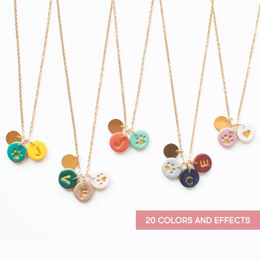 Personalized paw print necklace with initial charms in 24 colors