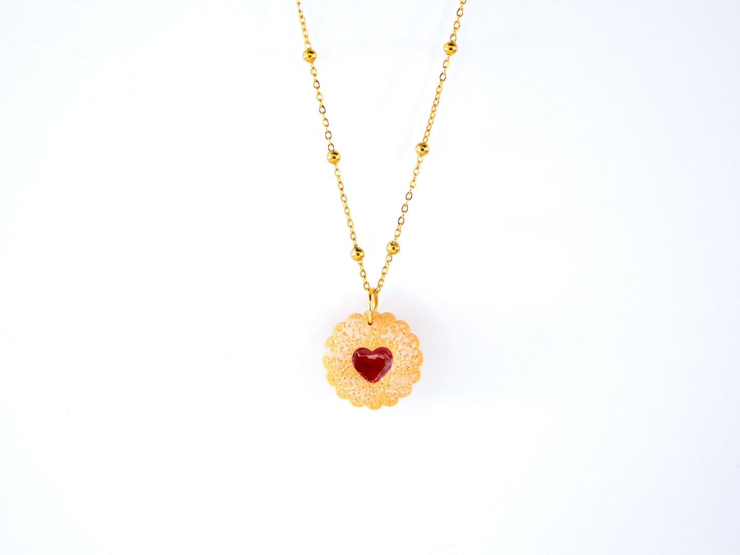 Round linzer biscuit charm necklace on gold satellite chain, handmade food jewelry