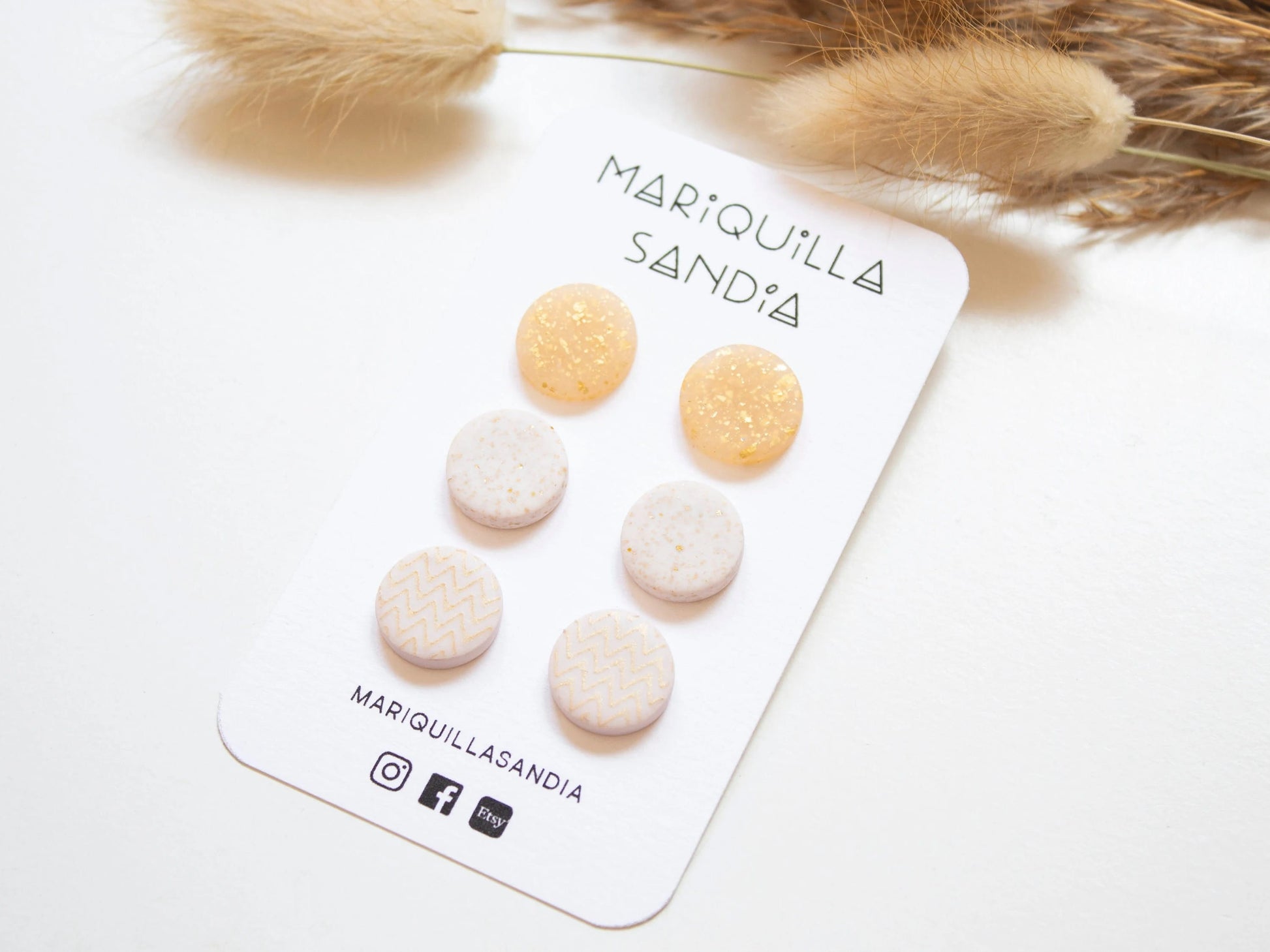 Elegant handmade stud earrings in a neutral color palette