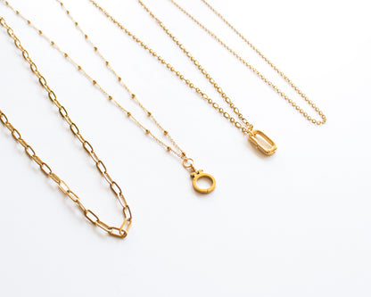 Necklace for charms cover photo showing four gold chain styles Paperclip Satellite Rolo and Dual Link 18k gold plated stainless steel dainty layering chains chain only optional charm holder available