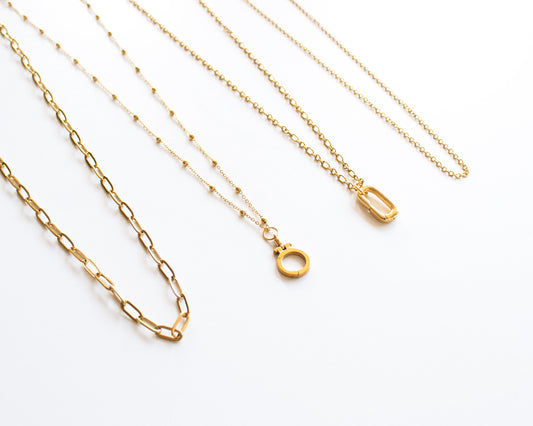 Necklace for charms cover photo showing four gold chain styles Paperclip Satellite Rolo and Dual Link 18k gold plated stainless steel dainty layering chains chain only optional charm holder available