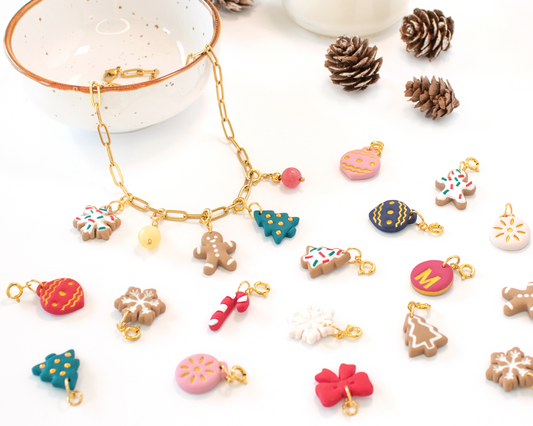 Handmade Christmas charm necklace with gingerbread and snowflake charms on gold paperclip chain