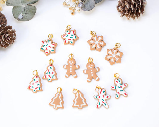 Full set of Christmas-themed handmade polymer clay charms, Gingerbread men, snowflakes, Christmas trees, and candy canes for festive hoop earrings.