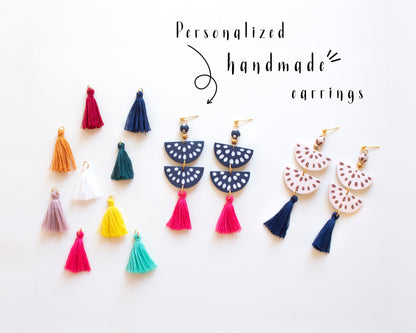 Collection of colorful handmade clay earrings with customizable tassels