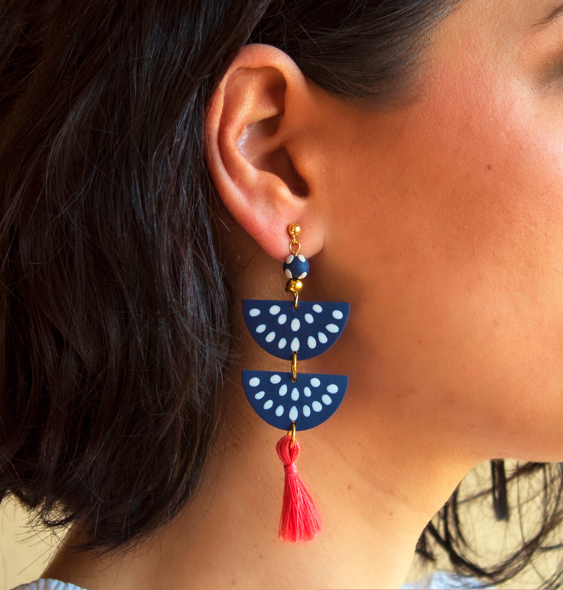 Handmade clay earrings in navy blue with customizable tassel options