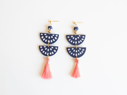 Handmade clay earrings in navy blue with customizable tassel options.