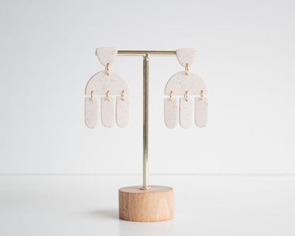 White geometric earrings made from polymer clay, hypoallergenic and lightweight, ideal for boho fashion lovers