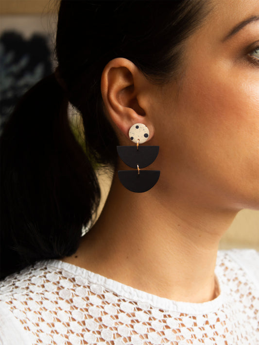 Black and white boho dangle earrings, handmade with hypoallergenic materials.