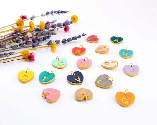 Close up of handmade polymer clay heart charms for necklaces
