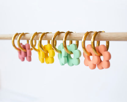 Customizable hoop earrings with interchangeable floral charm