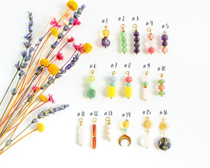 Numbered selection guide from 1 to 16 showing different natural stone charm styles with gold beads for customizing the earrings.